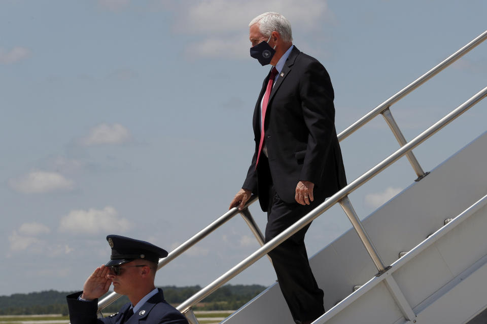 Vice President Mike Pence arrives at Raleigh Durham International Airport in Raleigh, N.C., Wednesday, July 29, 2020. (AP Photo/Gerry Broome)