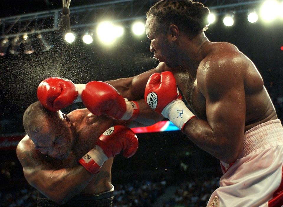 June 8, 2002: Lennox Lewis lands a right against Mike Tyson at The Pyramid.
