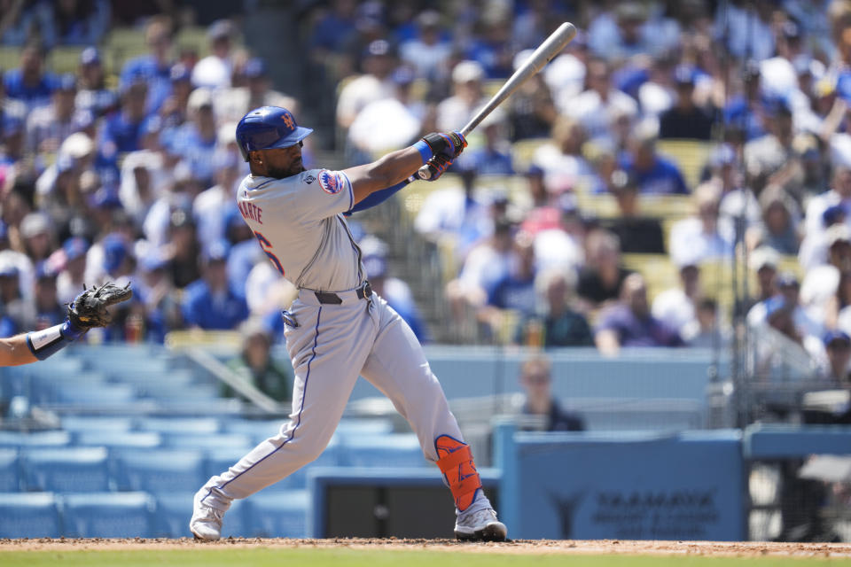 New York Mets' Starling Marte singles during the fourth inning of a baseball game against the Los Angeles Dodgers in Los Angeles, Saturday, April 20, 2024. Joey Wendle scored. (AP Photo/Ashley Landis)