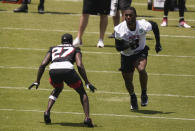 Atlanta Falcons' Kyle Pitts, right, practice with Richie Grant, left, during an NFL football rookie minicamp on Friday, May 14, 2021, in Flowery Branch, Ga. (AP Photo/Brynn Anderson)