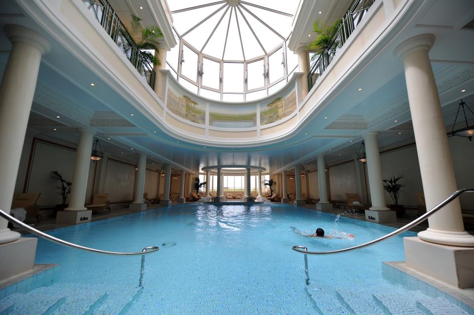 With an all-glass ceiling, the luxurious <strong>Hotel du Palais</strong> in Biarritz, France, features a sunlit indoor pool.