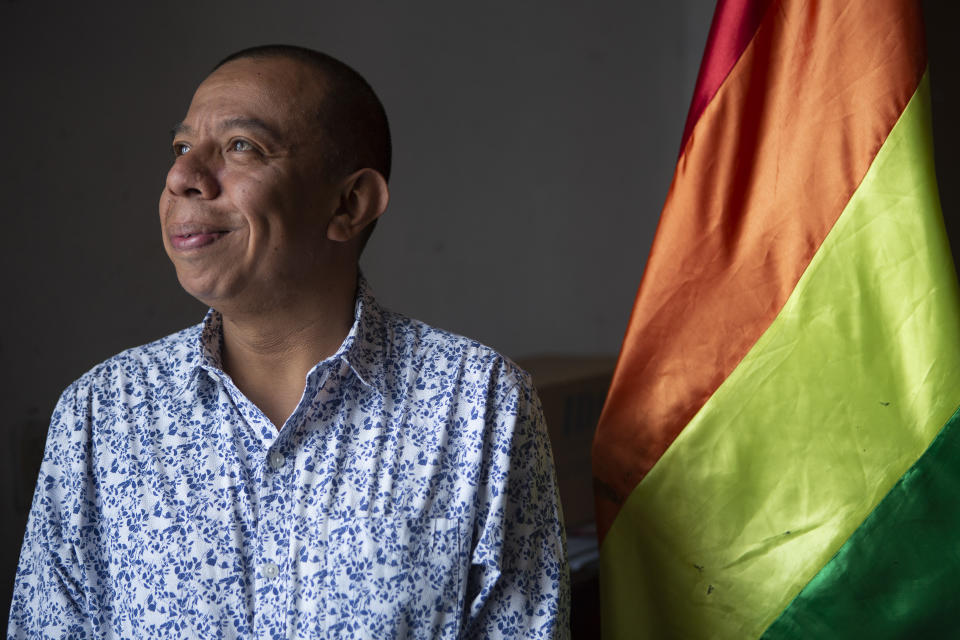 Aldo Davila, the first openly gay congressman-elect in Guatemala's history, poses for photos during an interview at his office in Guatemala City, Tuesday, June 18, 2019. Proudly gay and living with HIV, the 41-year-old businessman says the rainbow flag will not be his only cause. (AP Photo/Moises Castillo)