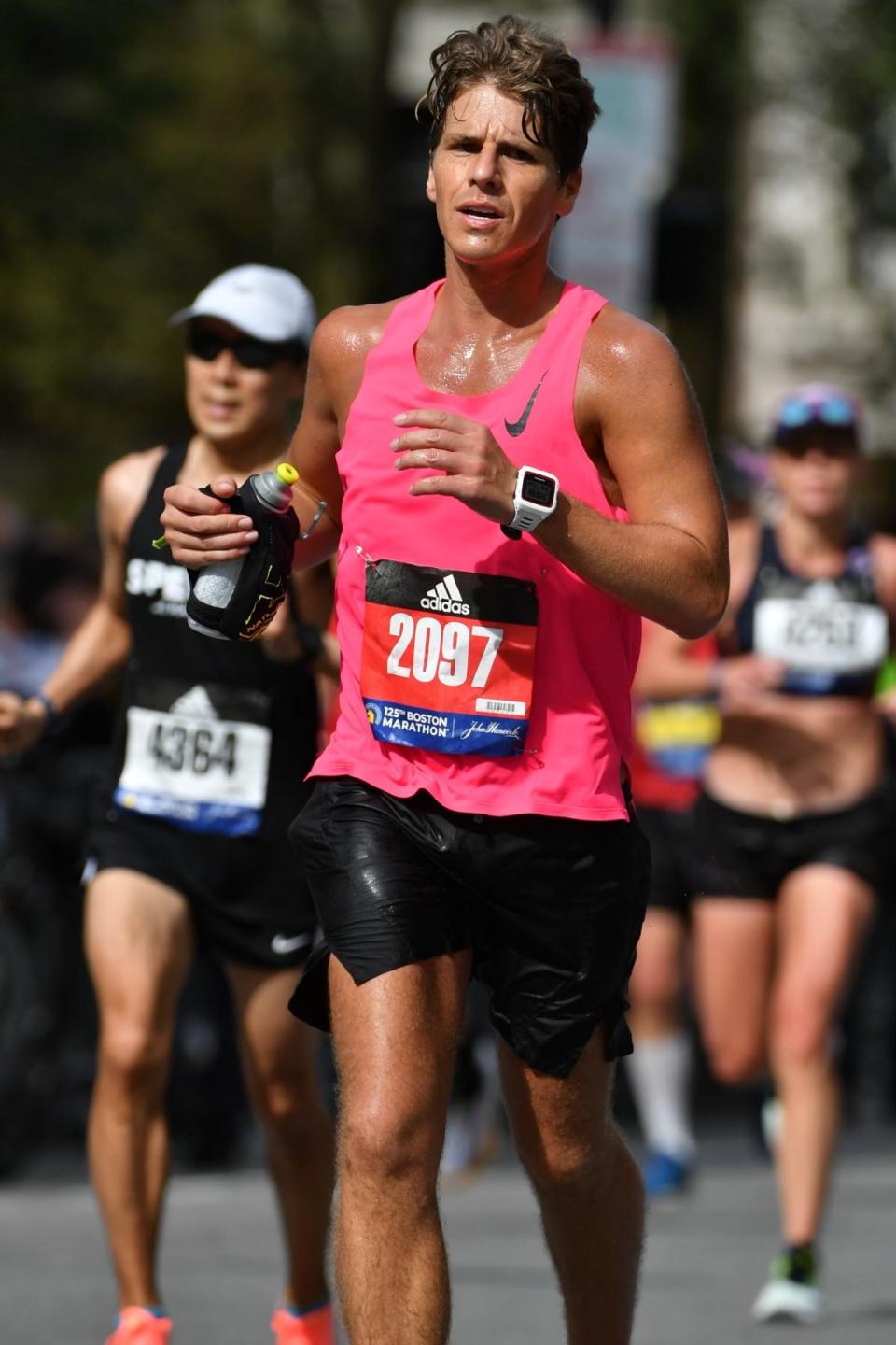 Justin Rollins running in the Boston Marathon.