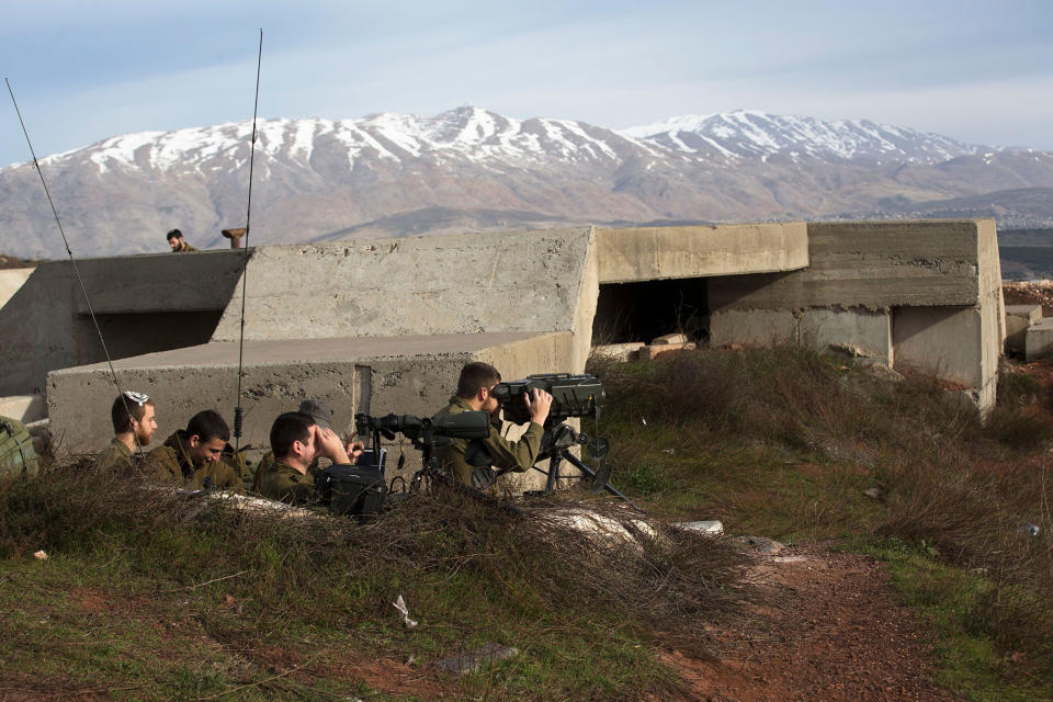 <p>Israeli soldiers take positions next to the Israeli-Syrian border following the Israel attack in Syria early morning, Feb. 10, 2018. (Photo: Atef Safadi/EPA-EFE/REX/Shutterstock) </p>