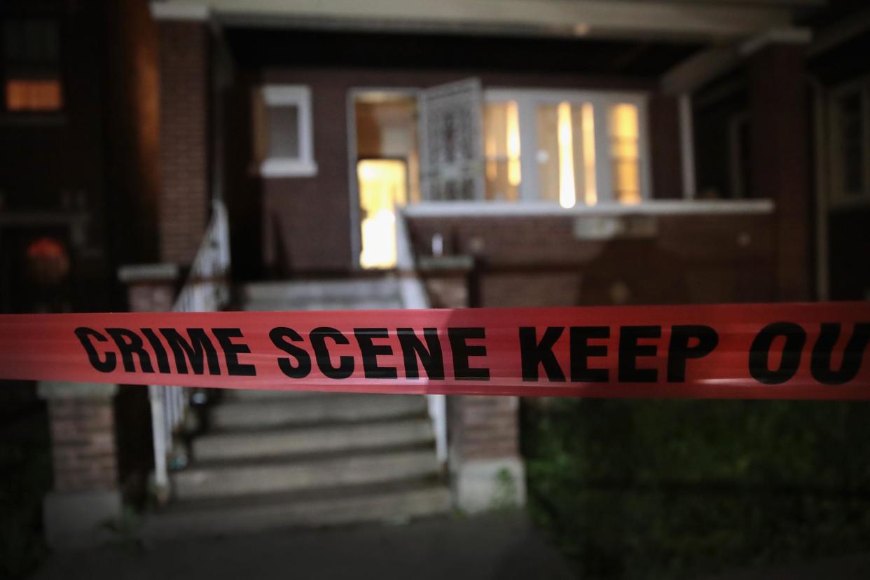 Police tape is shown around a house. Authorities are still investigating a shooting in Colerain Township, Ohio that injured eight: Scott Olson/Getty Images