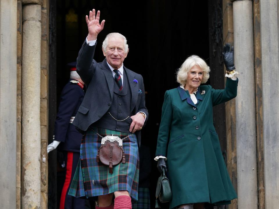 King Charles III and Camilla, Queen Consort, waves as they leave Dunfermline Abbey, after a visit to mark its 950th anniversary, and after attending a meeting at the City Chambers in Dunfermline where the King formally marked the conferral of city status on the former town on October 3, 2022