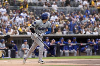 Los Angeles Dodgers' Shohei Ohtani watches his flyout during the first inning of a baseball game against the San Diego Padres, Saturday, May 11, 2024, in San Diego. (AP Photo/Gregory Bull)