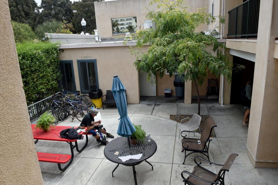 An artist draws in the patio of the Salvation Army's Hope Center in downtown Ventura during an open house in August.