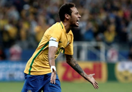 Neymar celebrates after scoring in a qualifier against Paraguay last year
