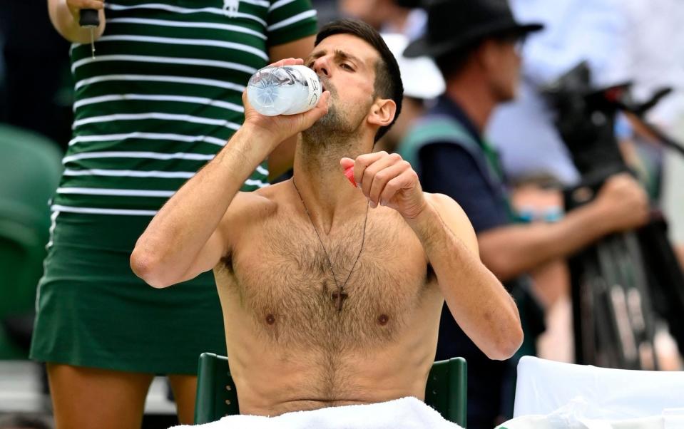 Novak Djokovic takes in fluids - REUTERS