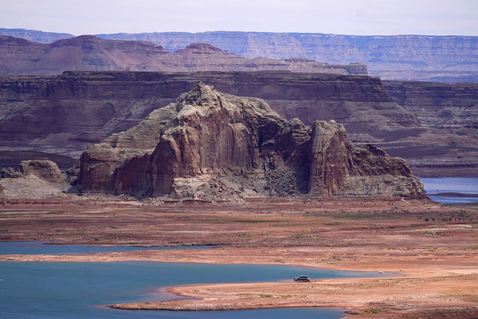 Low water levels at Wahweap Bay at Lake Powell along the Upper Colorado River Basin are shown Wednesday, June 9, 2021, at the Utah and Arizona border at Wahweap, Ariz. Included in the infrastructure deal that became law last month is $2.5 billion for Native American water rights settlements, which quantify individual tribes’ claims to water and identify infrastructure projects to help deliver it to residents. (AP Photo/Ross D. Franklin)