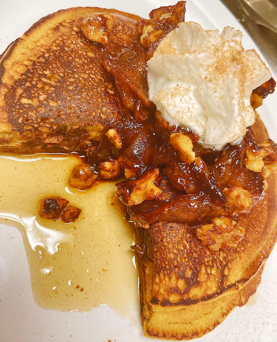 Pumpkin Chocolate Chip Pancakes with homemade caramel apple walnut topping at Missy's Main Street Cafe.