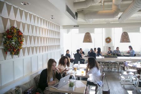 Customers sit at tables at Cafe Gratitude on Rose Avenue in Venice, California November 7, 2014. REUTERS/Jonathan Alcorn