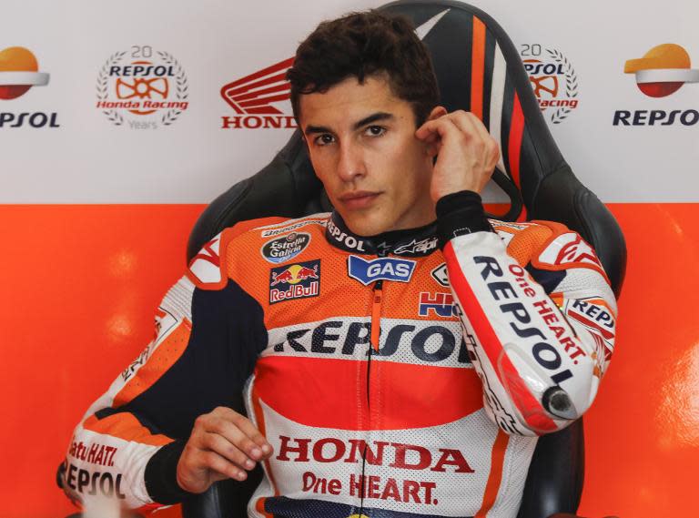 Honda Team rider Marc Marquez of Spain sits inside his team garage in Sepang, Malaysia on February 5, 2015