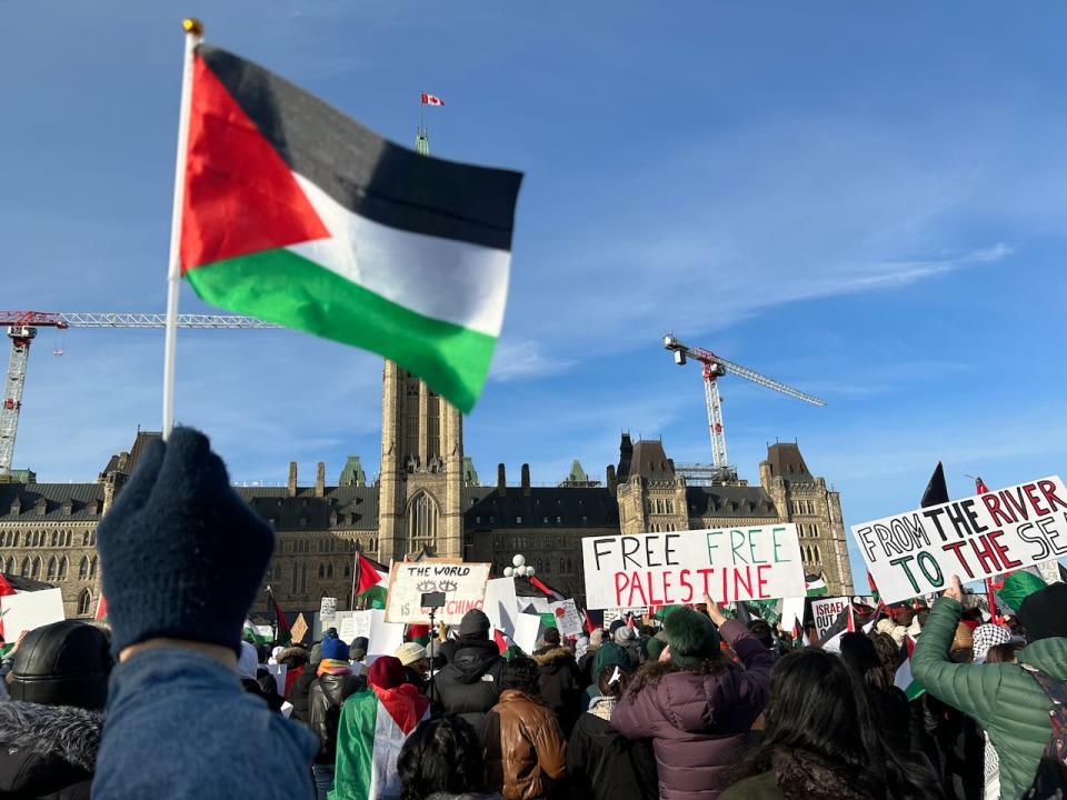 People gather on Parliament Hill to call for a ceasefire in the conflict between Hamas and Israel.