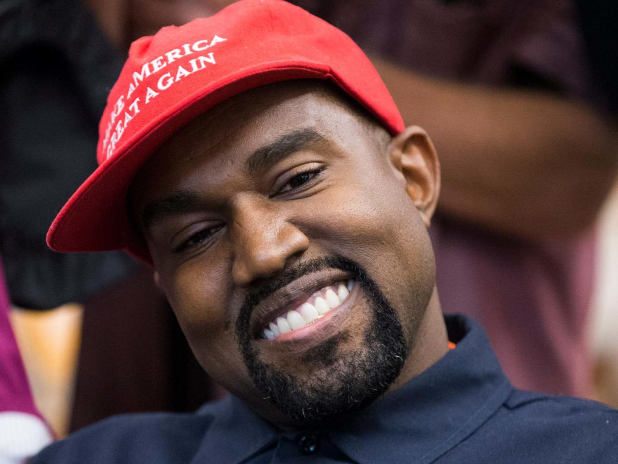 Kanye West wearing president Trump baseball cap in 2018: EPA