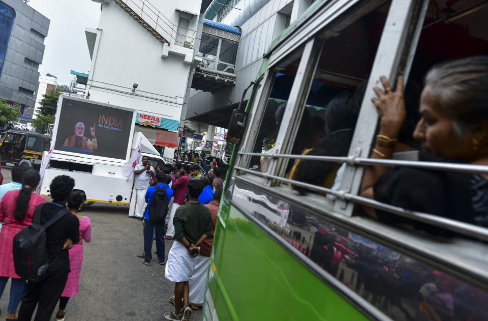 Activists of the Democratic Youth Front of India hold a public screening of BBC documentary “India: The Modi Question” outside a bus terminus in Kochi, India, Tuesday, Jan.24, 2023. Days after India blocked the BBC documentary that examines Prime Minister Narendra Modi’s role during 2002 anti-Muslim riots and banned people from sharing it online, authorities are scrambling to halt screenings of the program at colleges and universities and restrict clips of it on social media, a move that has been decried by critics as an assault on press freedom. (AP Photo/Sunoj Ninan Mathew)