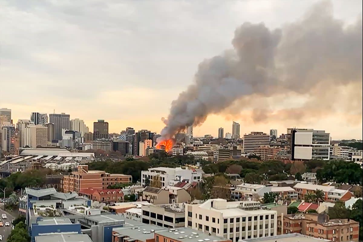 Smoke seen rising into the sky as massive fire engulfs two buildings in central Sydney (Facebook page of Michael Goode/A)