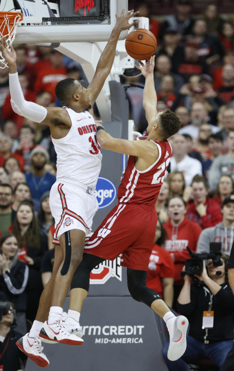 Wisconsin guard Kobe King, right, goes up to shoot in front of Ohio State forward Kaleb Wesson during the second half of an NCAA college basketball game in Columbus, Ohio, Friday, Jan. 3, 2020. (AP Photo/Paul Vernon)