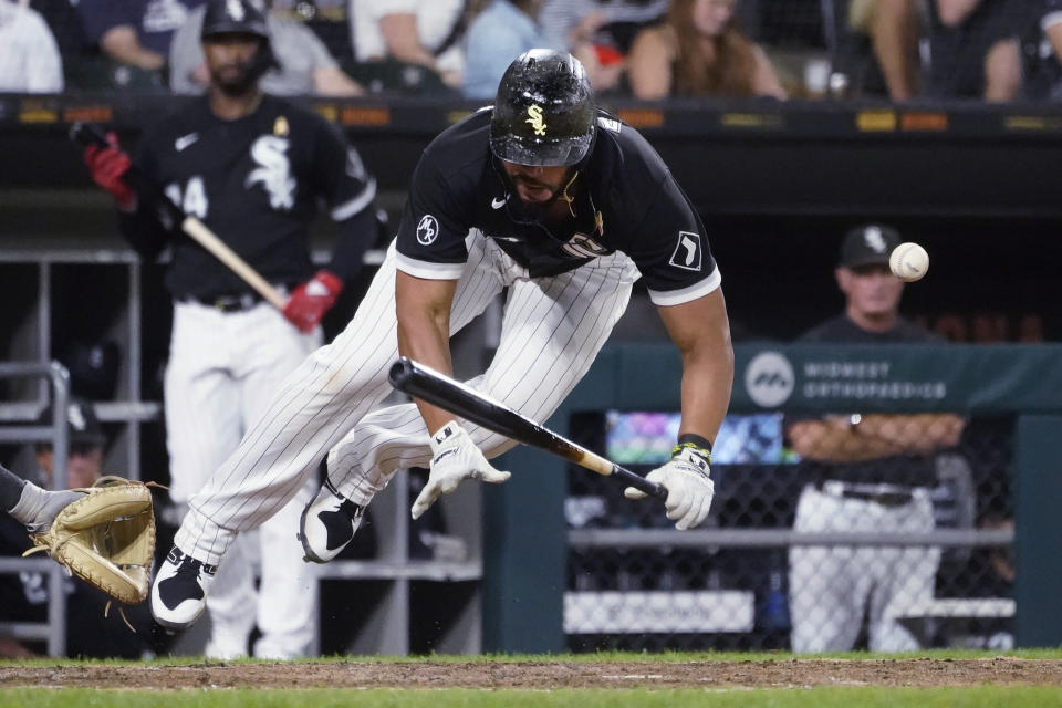 Chicago White Sox's Jose Abreu is hit by a pitch from Pittsburgh Pirates' Anthony Banda during the sixth inning of a baseball game Wednesday, Sept. 1, 2021, in Chicago. (AP Photo/Charles Rex Arbogast)