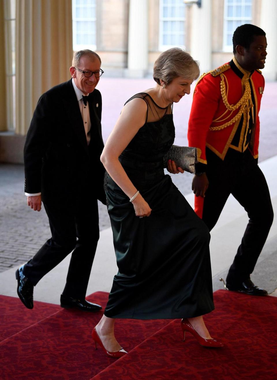 Theresa May arrives with her husband (AFP/Getty Images)