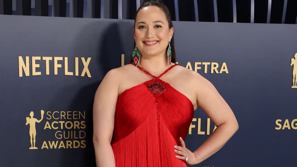 Lily Gladstone in a floor-length flapper-style Armani Privé gown. - Brian van der Brug/Los Angeles Times/Getty Images