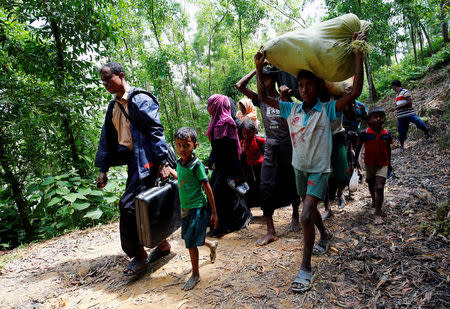 Rohingya people walk towards the makeshift shelter near the Bangladesh-Myanmar border, after being restricted by the members of Border Guards Bangladesh (BGB), to further enter the Bangladesh side, in Cox’s Bazar, Bangladesh August 28, 2017. REUTERS/Mohammad Ponir Hossain