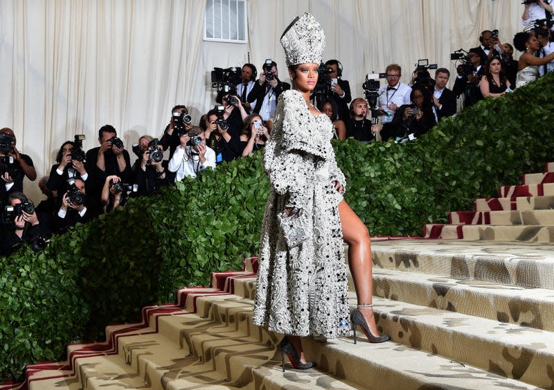 Rihanna arrives for the 2018 Met Gala on May 7, 2018, at the Metropolitan Museum of Art in New York. The Gala raises money for the Metropolitan Museum of Art’s Costume Institute. The Gala’s 2018 theme is “Heavenly Bodies: Fashion and the Catholic Imagination.” - Photo: Hector RETAMAL / AFP (Getty Images)