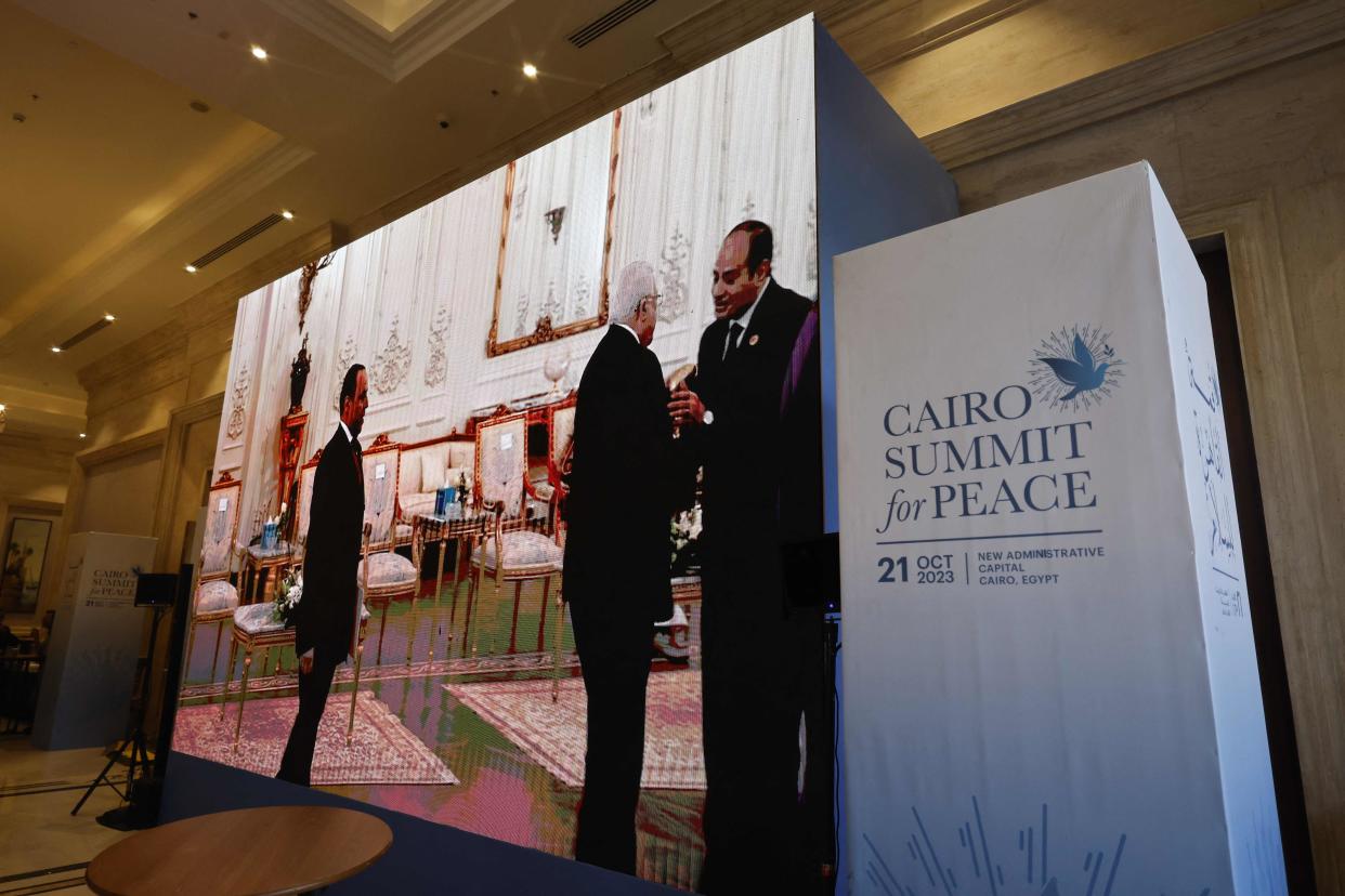 The Palestinian president Mahmud Abbas is greeted by the Egyptian President Abdel-Fattah al-Sisi (right) prior to the start of the International 'Summit for Peace' (AFP via Getty Images)