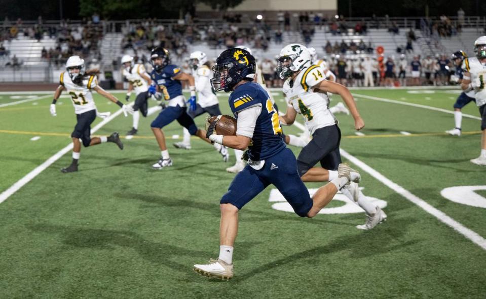 Gregori’s Michael Marsden outruns the Livermore defense for a touchdown at Gregori High School in Modesto, Calif., Friday, September 8, 2023. Gregori won the game 41-17.