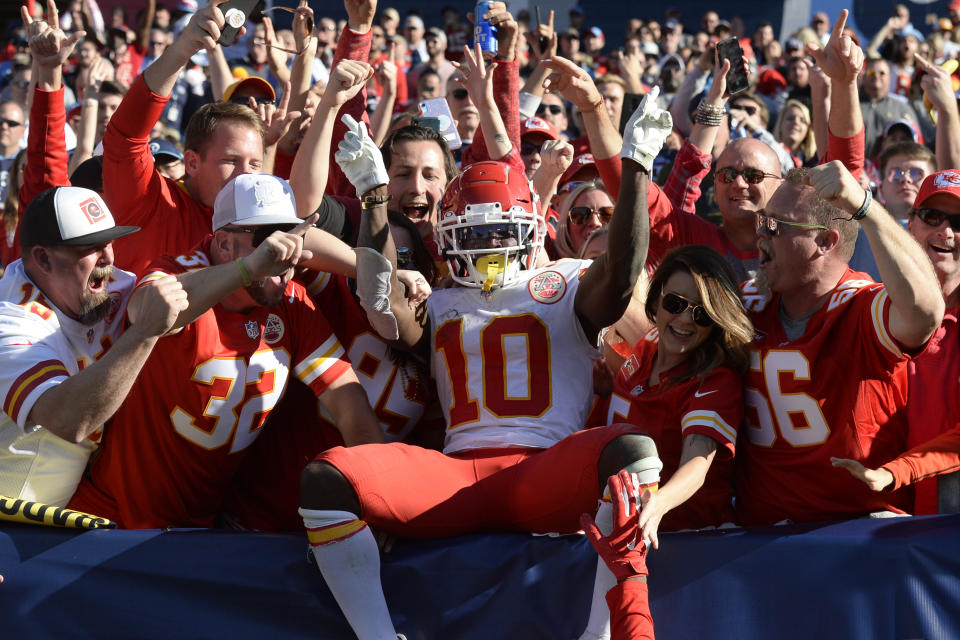 Kansas City Chiefs wide receiver Tyreek Hill (10) celebrates with fans after scoring a touchdown against the Tennessee Titans in the second half of an NFL football game Sunday, Nov. 10, 2019, in Nashville, Tenn. (AP Photo/Mark Zaleski)