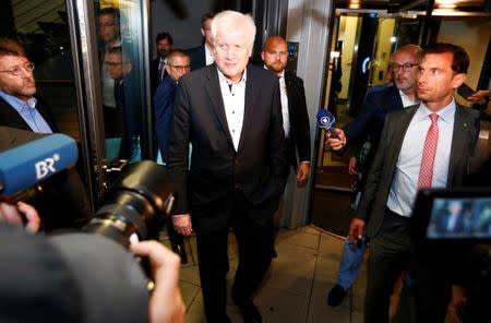 German Interior Minister Horst Seehofer leaves a Christian Social Union (CSU) leadership meeting in Munich, Germany July 2, 2018. REUTERS/Michaela Rehle