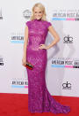 Someone knows how to turn up the heat! The newlywed rocked the red carpet at the American Music Awards in a fuchsia Abed Mahfouz gown. (11/18/2012)