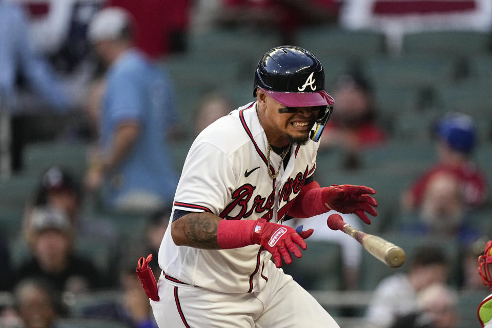 Atlanta Braves' Orlando Arcia reacts after being hit by a pitch from Cincinnati Reds' Hunter Greene during the second inning of a baseball game Wednesday, April 12, 2023, in Atlanta. (AP Photo/John Bazemore)