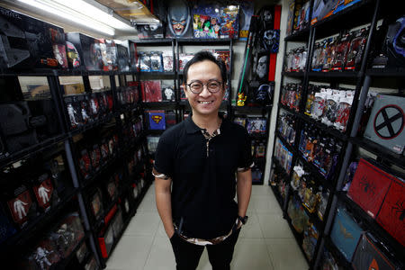 Andy Kurniawan, who is the owner of an action figure store, poses for a photograph at his store in Jakarta, Indonesia, November 14, 2018. REUTERS/Willy Kurniawan