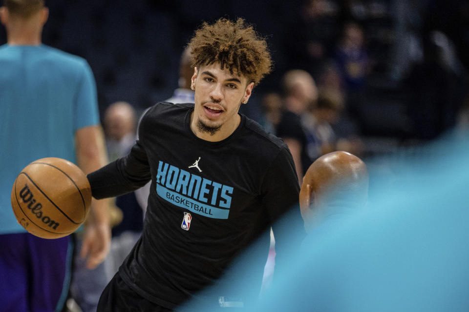 Charlotte Hornets guard LaMelo Ball warms up before an NBA basketball game against the Golden State Warriors, Saturday, Oct. 29, 2022, in Charlotte, N.C. (AP Photo/Scott Kinser)