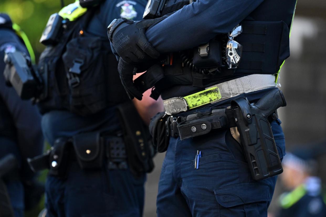 <span>A 36-year-old Brunswick woman was arrested at the scene for allegedly assaulting police and was released pending further enquiries, Victoria police said.</span><span>Photograph: James Ross/AAP</span>