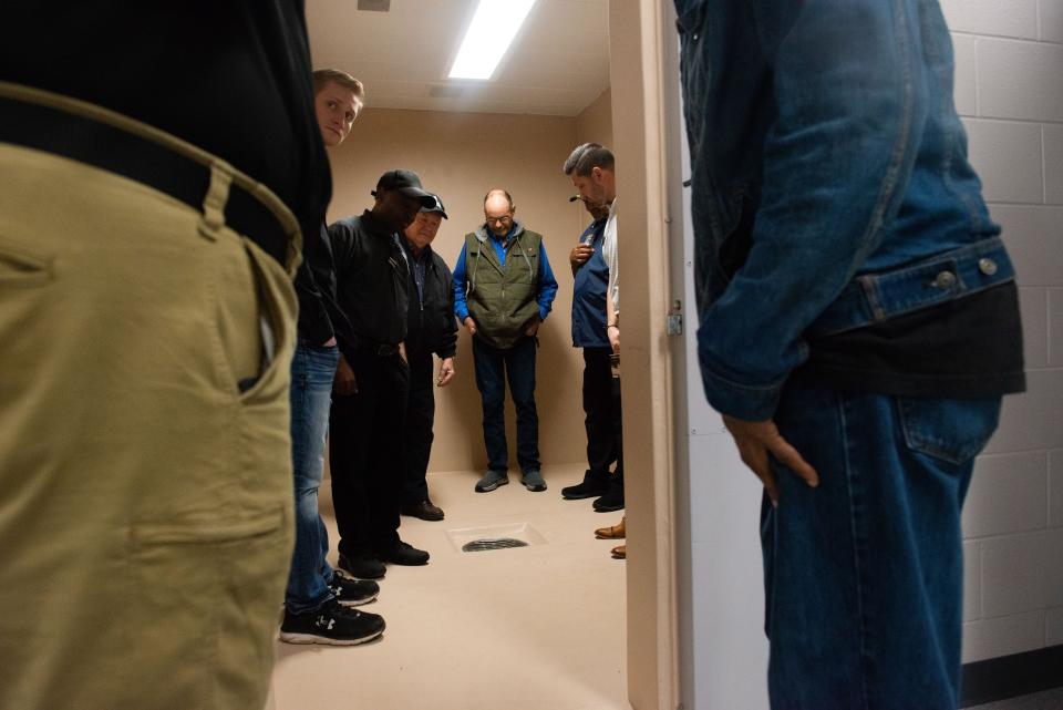 Tour attendees look inside the new holding room for trouble inmates inside the newly expanded Madison County Jail in Jackson, Tenn. on Thursday, Mar. 9, 2023. The renovations expands the available housing from 303 inmates, to now 518 inmates. 