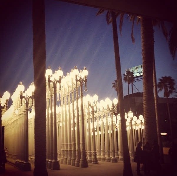 Chris Burden's <em>Urban Light</em> structure is an<a href="http://articles.latimes.com/2011/jan/25/entertainment/la-et-urban-light-as-icon-20110125" target="_blank"> iconic part of LACMA</a> -- around 200 vintage lampposts arranged in rows that light up magically at night.  In the past few years since instillation, they've popped up in a <a href="http://www.huffingtonpost.com/2011/01/25/urban-light-at-lacma-make_n_813824.html#s229527title=No_Strings_Attached" target="_blank">wide range of media</a>, including movies, commercials, fashion shoots, and music videos.