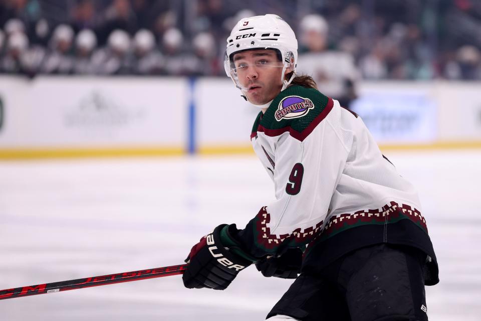 Clayton Keller (9) of the Arizona Coyotes skates against the Seattle Kraken during the first period at Climate Pledge Arena on April 6, 2023, in Seattle, Wash.