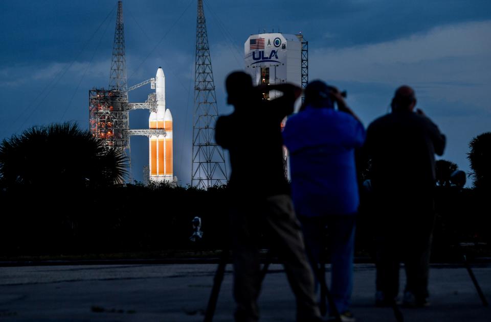 Members of the media watch and photograph a United Launch Alliance Delta IV Heavy as the service tower rolls back in preparation for launch Thursday, March 28, 2024 from Cape Canaveral Space Force Station. Craig Bailey/FLORIDA TODAY via USA TODAY NETWORK