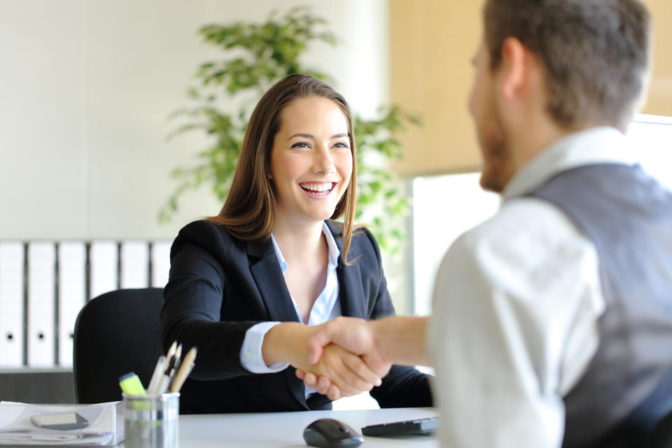 Businesspeople shaking hands after an interview