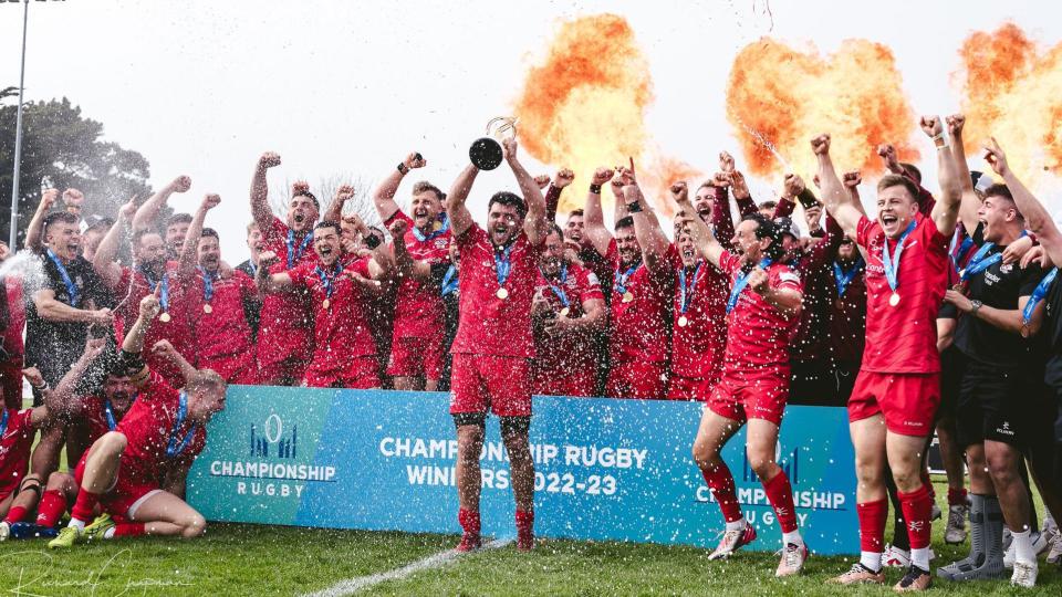 Jersey Reds celebrate winning the Championship