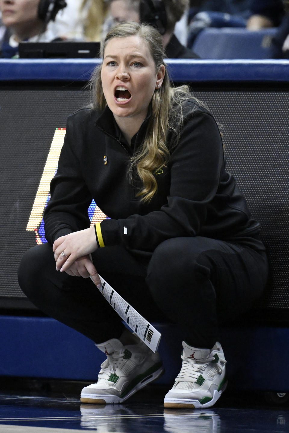 Vermont head coach Alisa Kresge calls out to her team in the first half of a first-round college basketball game against UConn in the NCAA Tournament, Saturday, March 18, 2023, in Storrs, Conn. (AP Photo/Jessica Hill)