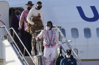 Kansas City Chiefs cornerback L'Jarius Sneed, center, arrives for the NFL Super Bowl 55 football game against the Tampa Bay Buccaneers, Saturday, Feb. 6, 2021, in Tampa, Fla. (AP Photo/Chris O'Meara)