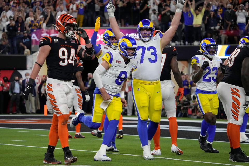 Los Angeles Rams quarterback Matthew Stafford (9) celebrates with guard David Edwards (73) after Stafford threw a touchdown to wide receiver Cooper Kupp against the Cincinnati Bengals during the second half of the NFL Super Bowl 56 football game Sunday, Feb. 13, 2022, in Inglewood, Calif. (AP Photo/Mark J. Terrill)