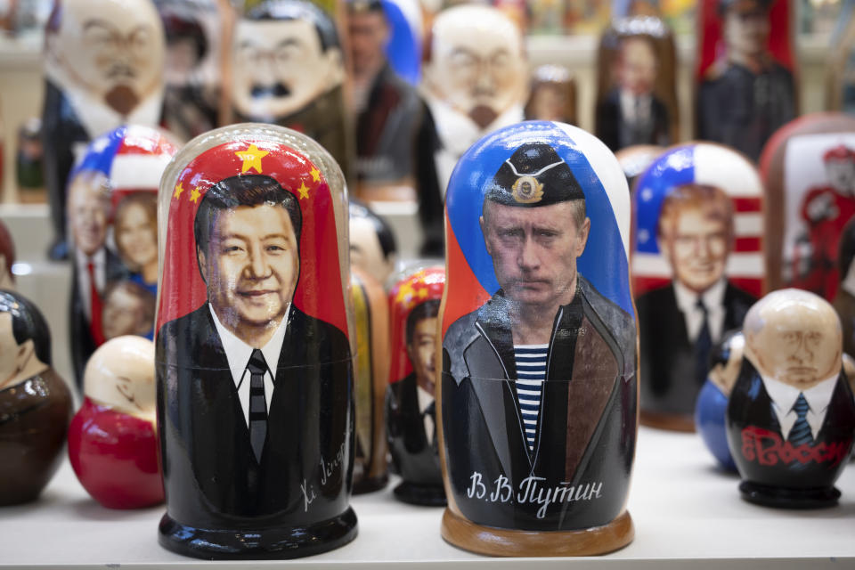 Russian matryoshka dolls with portraits of the Chinese President Xi Jinping, left, and Russian President Vladimir Putin are displayed among others for sale at a souvenir shop in Moscow, Russia, Tuesday, March 21, 2023. Chinese President Xi Jinping arrived in neighbouring Russia for a three-day trip for the talks with Russian President Vladimir Putin. (AP Photo/Dmitry Serebryakov)