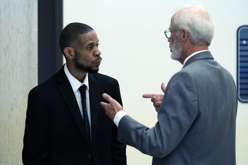 Kecalf Franklin, a son of music superstar Aretha Franklin, talks with attorney Charles McKelvie, right, outside a courtroom, Monday, July 10, 2023, in Pontiac, Mich. Five years after her death, the final wishes of Franklin are still unsettled. An unusual trial began Monday to determine which of two handwritten wills, including one found in couch cushions, will guide how her estate is handled. (AP Photo/Carlos Osorio)