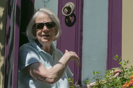 Nancy Curtis, mother of American writer Peter Theo Curtis, briefly answers reporters' questions outside her home in Cambridge, Massachusetts August 25, 2014. REUTERS/Brian Snyder