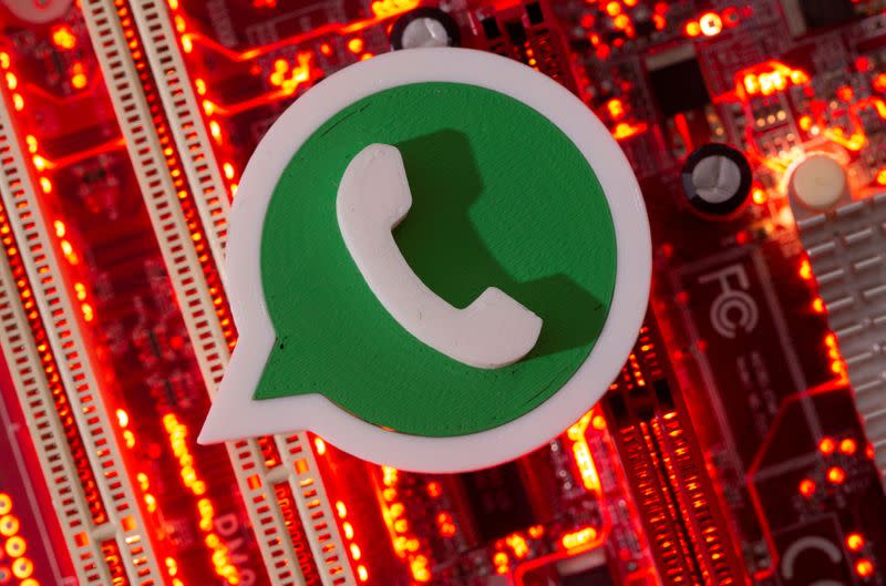 FILE PHOTO: A 3D printed Whatsapp logo is placed on a computer motherboard